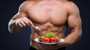 buff guy eating a healthy meal